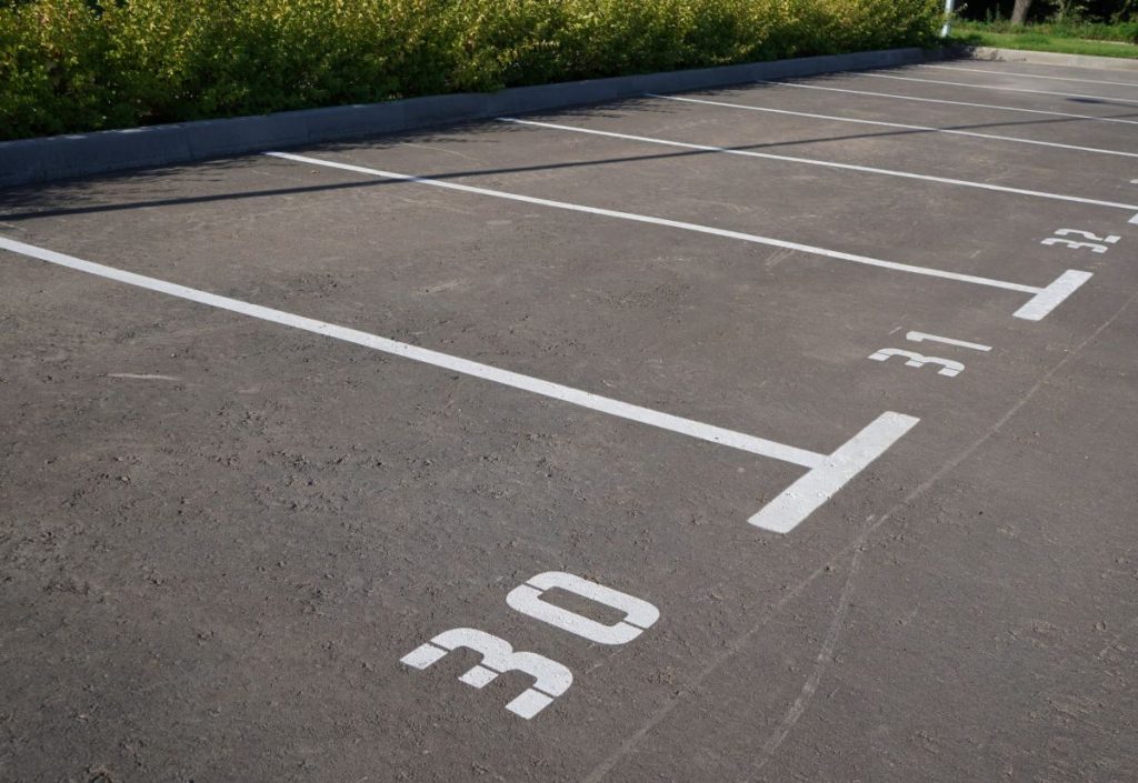 Parking lot with numbered spots as an example of a limited common element