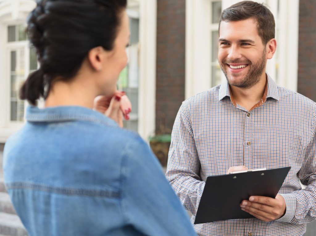 Condominium property manager giving a tour to a potential buyer.